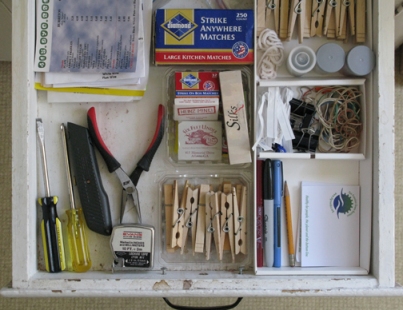 organizing a kitchen junk drawer using trash