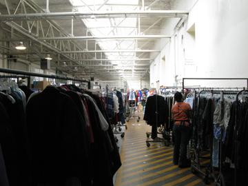 racks of clothes sorted for distribution to San Francisco's Goodwill retail stores